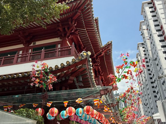 Colorful temple with lanterns and flowers
